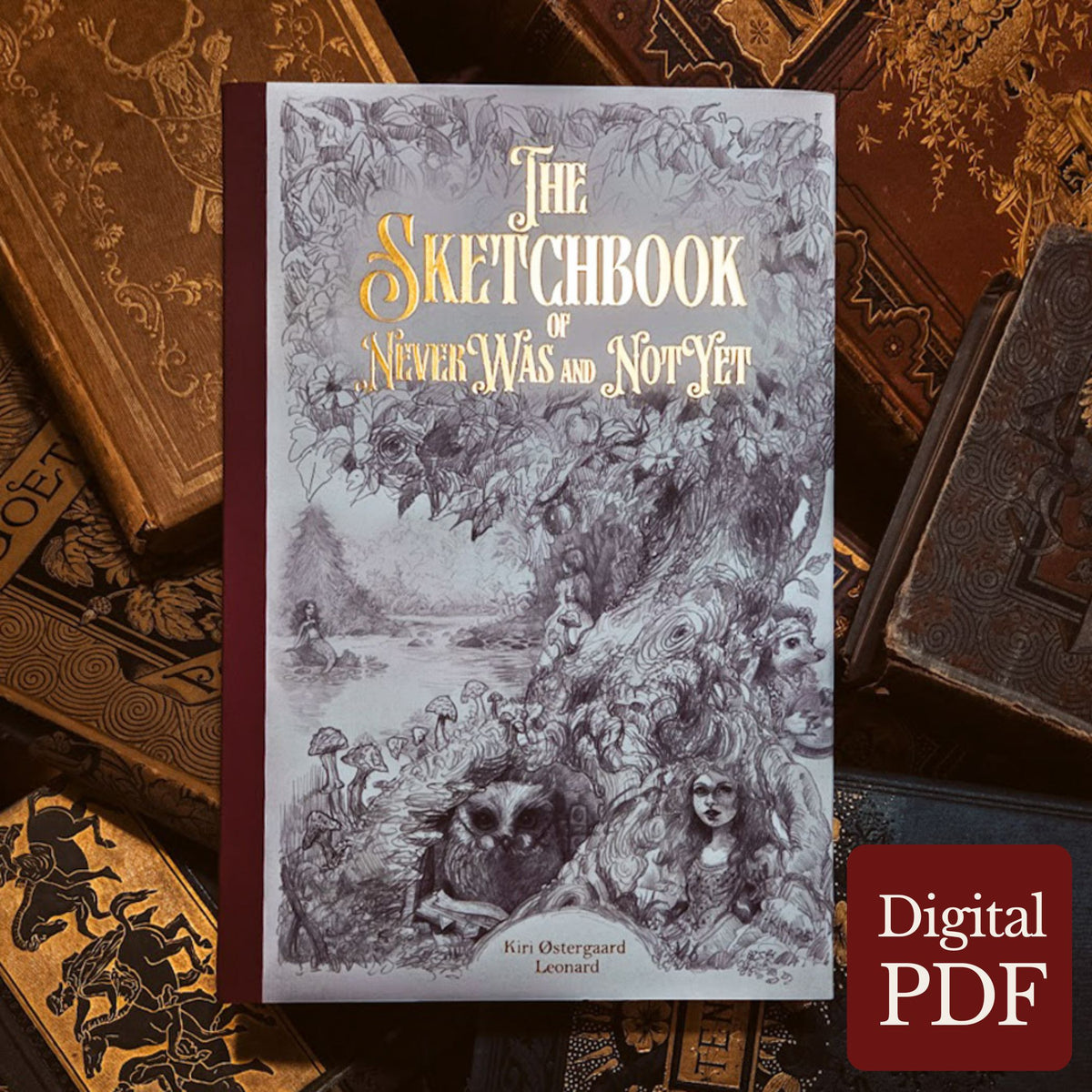 A hardcover sketchbook titled "The Sketchbook of NeverWas and NotYet" by Kiri Oestergard Leonard, displayed upright on a styled background of old books. The cover features intricate black and white fantasy illustration with gold title lettering.